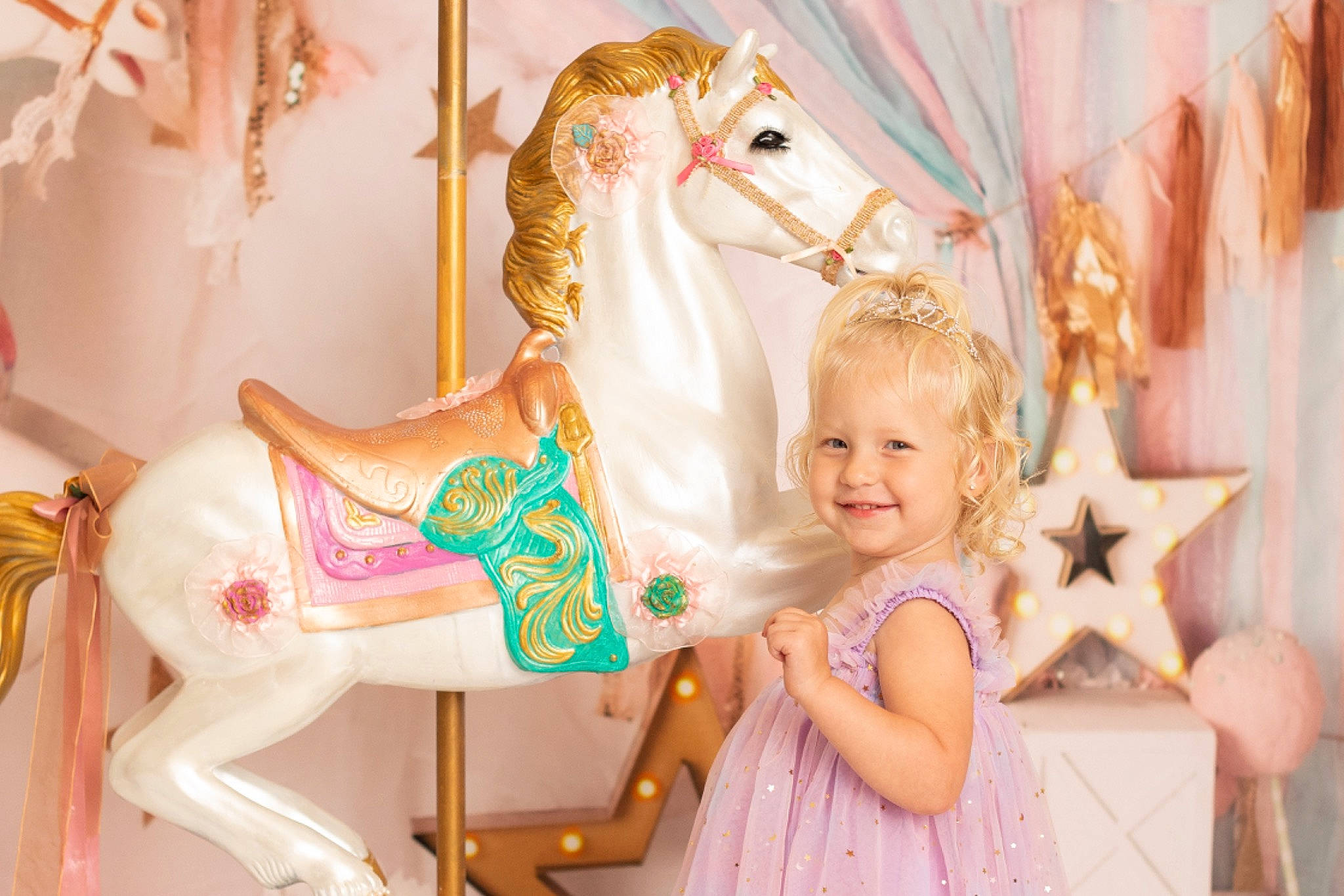 Camille joined the competition — help win amazing prizes! amusement_park, amusement_ride, carousel, event, eye, fawn, fun, happy, horse, horse_tack, joy, nonbuilding_structure, person, photograph, pink, recreation, smile, snapshot, toddler, toy