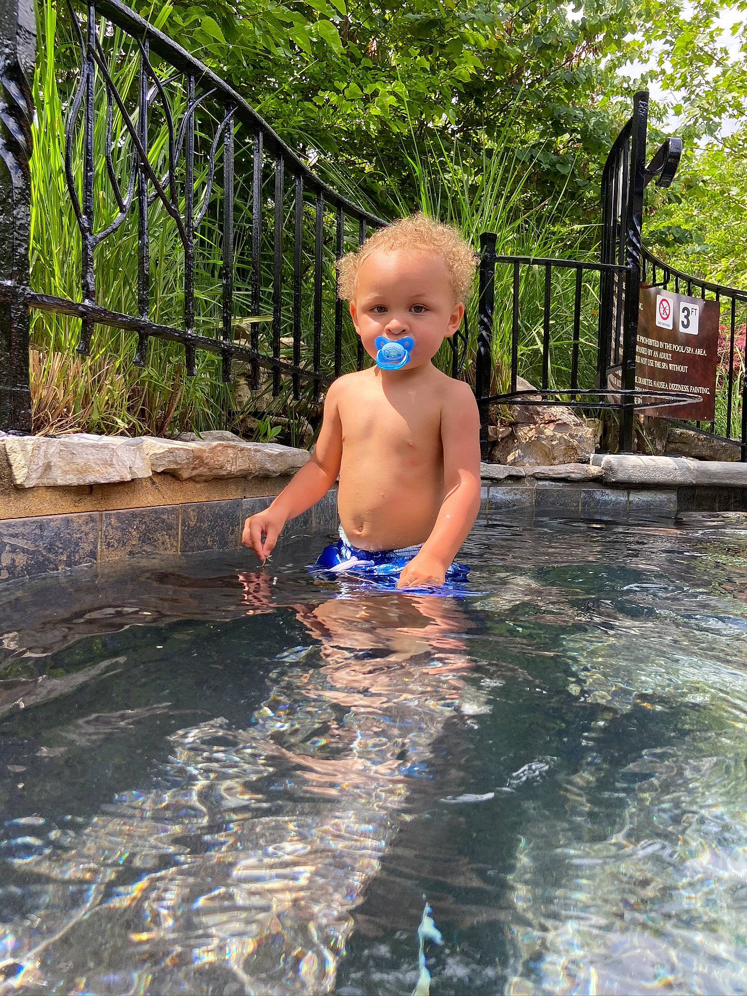 Jamari is registered to the contest to win money with this photo: barechested, barefoot, bathing, chest, child, fence, fun, garden, grass, leisure, people_in_nature, person, plant, play, recreation, swimwear, toddler, tree, vacation, water