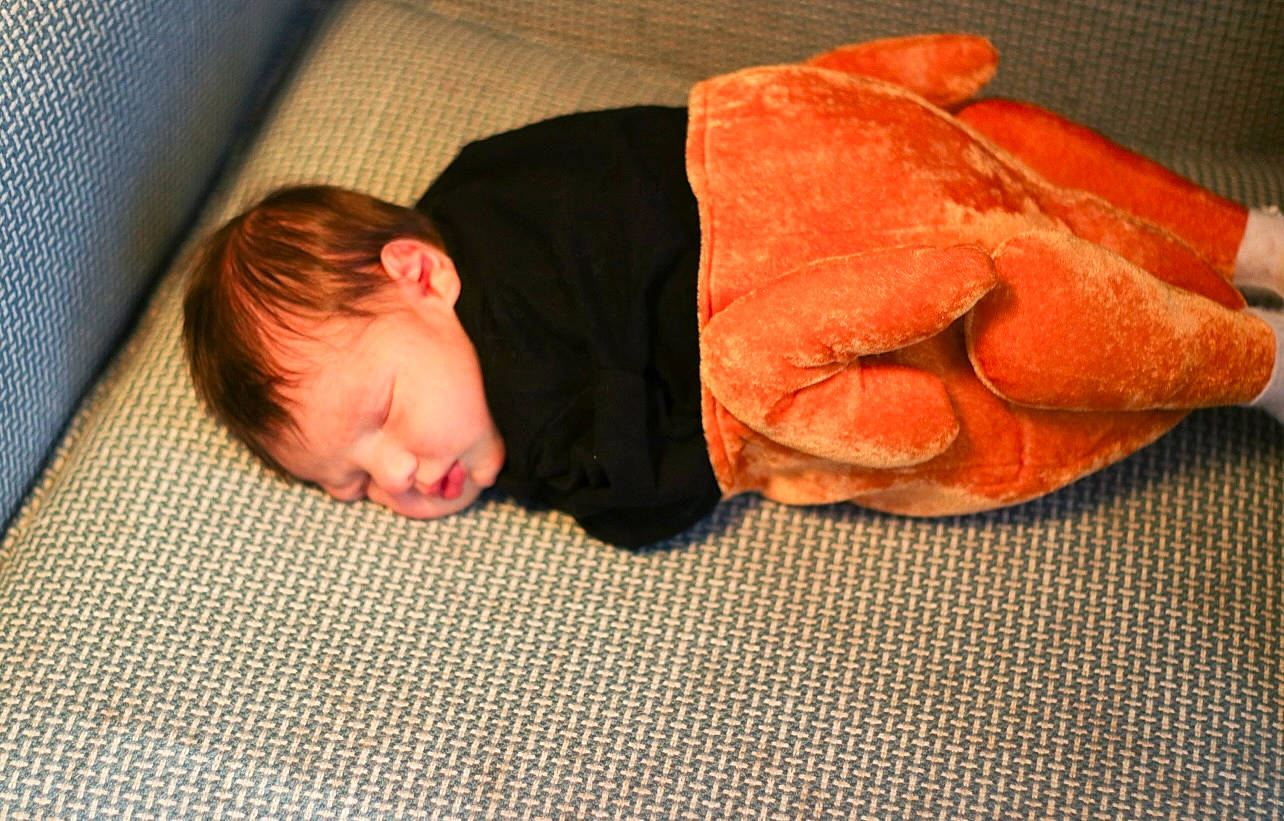 Bryan is registered to the contest to win money with this photo: baby, baby_sleeping, baby_toddler_clothing, bedding, bedtime, carmine, child, comfort, flooring, hardwood, linens, nap, orange, person, room, sitting, sleep, sleeve, toddler, wood