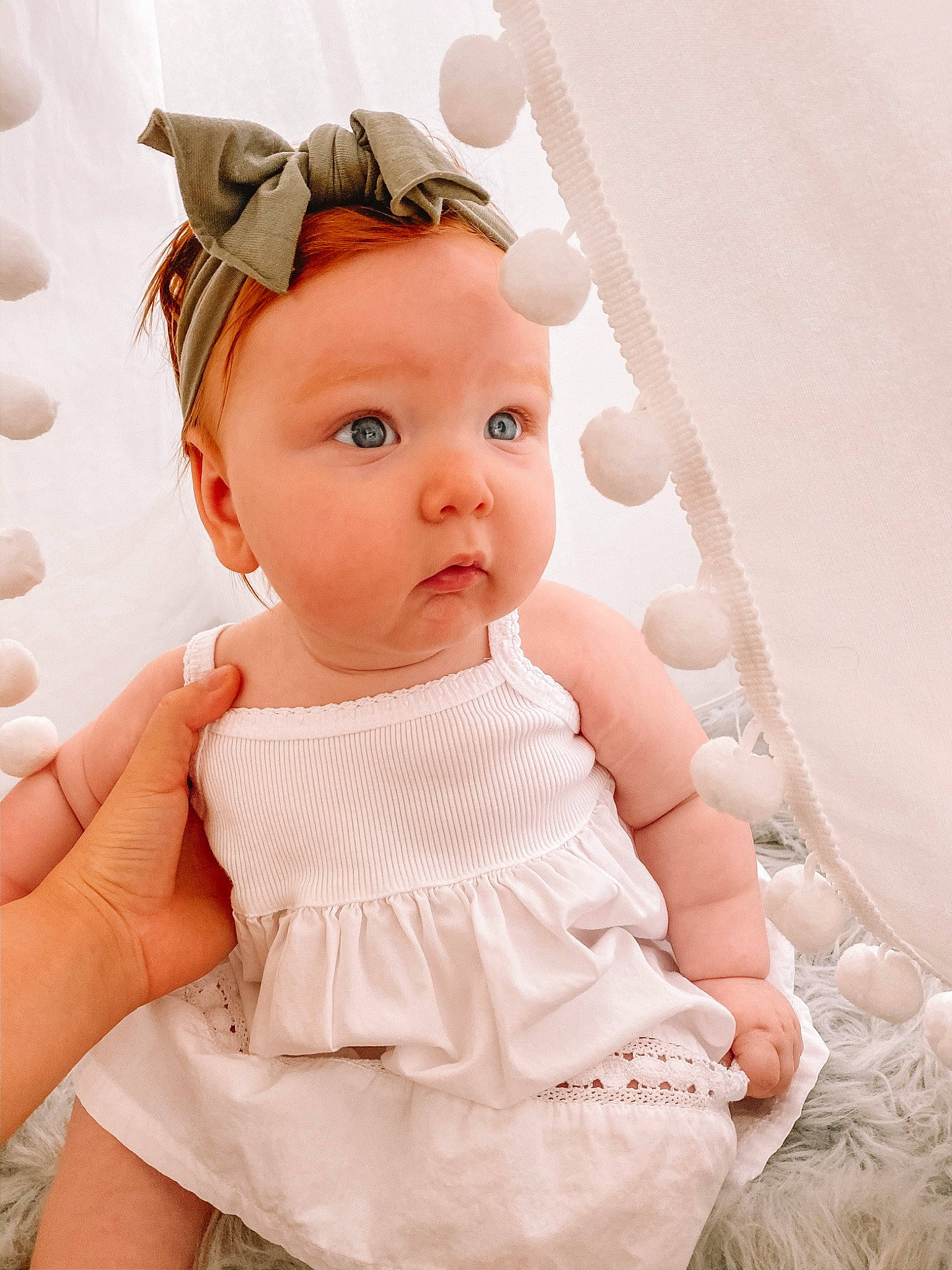 Amellia is registered to the contest to win money with this photo: baby, baby_products, baby_toddler_clothing, cheek, child, dress, eye, fashion_accessory, hair_accessory, hand, head, headgear, pattern, person, photography, pink, product, skin, smile, surprise