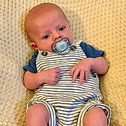 Jace joined the competition — help win amazing prizes! baby, pacifier, striped_clothing, blue_shirt, blanket, infant, cute, hands, legs, face, relaxing, texture, pattern, newborn, child, portrait, sitting, comfort, skin, young