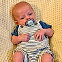 baby, pacifier, striped_clothing, blue_shirt, blanket, infant, cute, hands, legs, face, relaxing, texture, pattern, newborn, child, portrait, sitting, comfort, skin, young