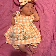 Zayla joined the competition — help win amazing prizes! baby, newborn, sleeping, dress, headband, bow, pink_blanket, infant, cute, peaceful, clothing, tiny_toes, soft_texture, lying_down, adorable, child, portrait, close_up, comfort, resting
