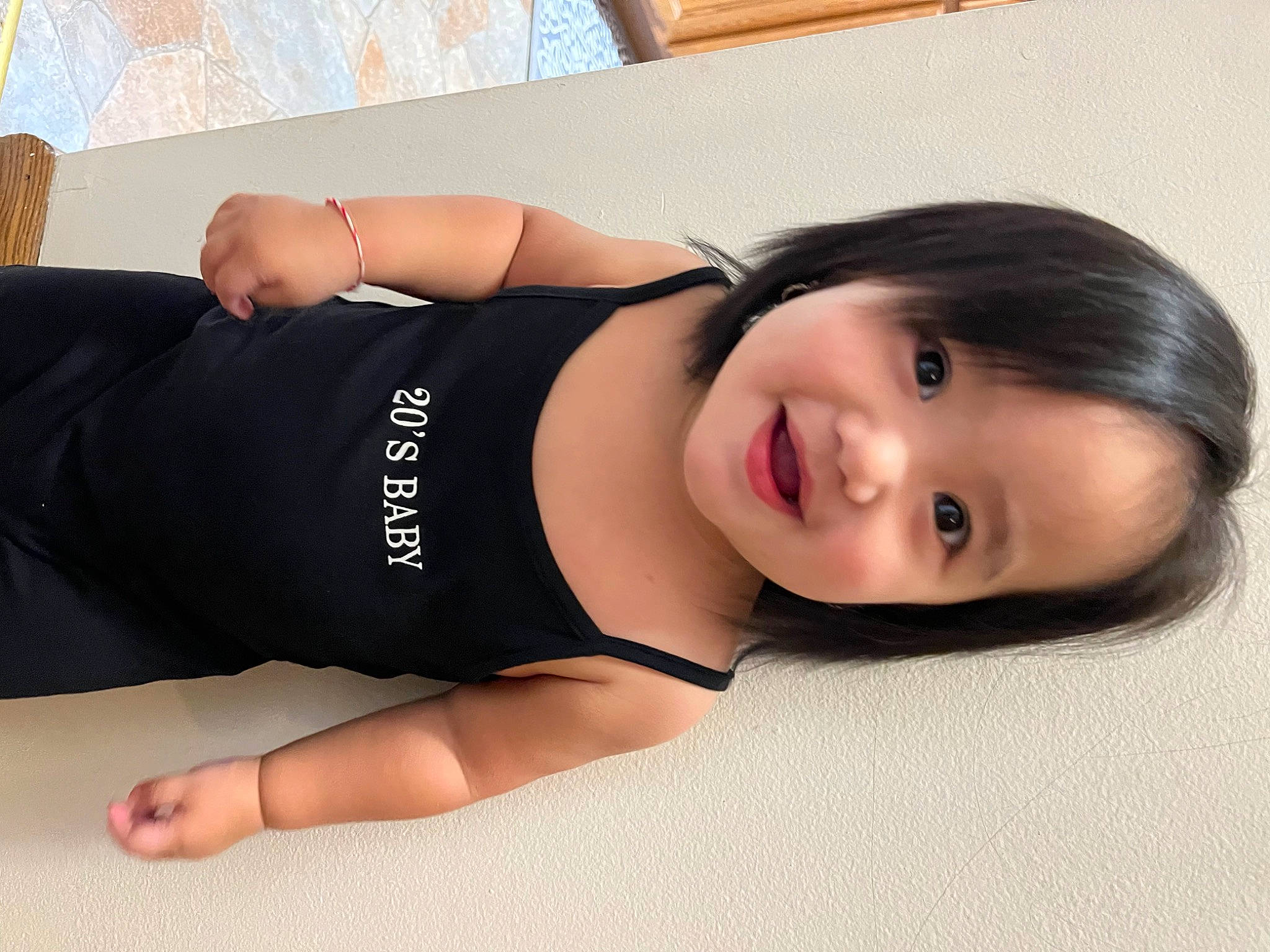 Aaliyah Yang is registered to the contest to win money with this photo: black_hair, chest, comfort, elbow, eyelash, flash_photography, flooring, gesture, human_leg, joint, joy, knee, neck, person, shoulder, sleeve, smile, sportswear, thigh, trunk