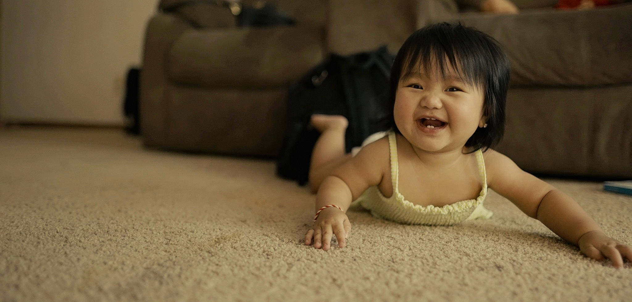 Aaliyah Yang joined the competition — help win amazing prizes! baby, baby_toddler_clothing, cheek, comfort, couch, crawling, eye, face, flash_photography, floor, flooring, happy, hardwood, head, nose, person, sitting, skin, smile, toddler