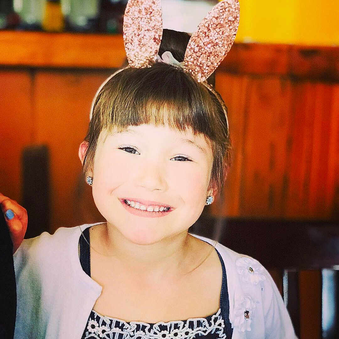 Kaylin is registered to the contest to win money with this photo: child, ear, fashion_accessory, fawn, hair_accessory, happy, head, headgear, human_body, joy, organ, person, smile