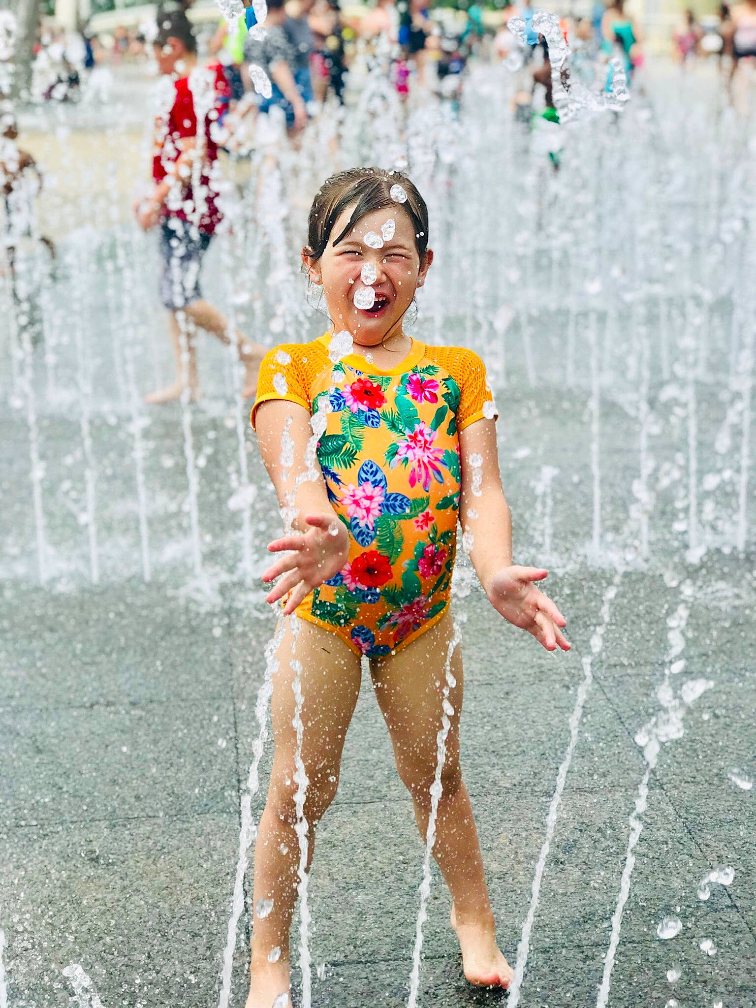Kaylin is registered to the contest to win money with this photo: carnival, event, festival, fountain, fun, joy, leisure, leotard, nonbuilding_structure, person, recreation, smile, sportswear, street_fashion, summer, vacation, water, water_feature, water_park, yellow