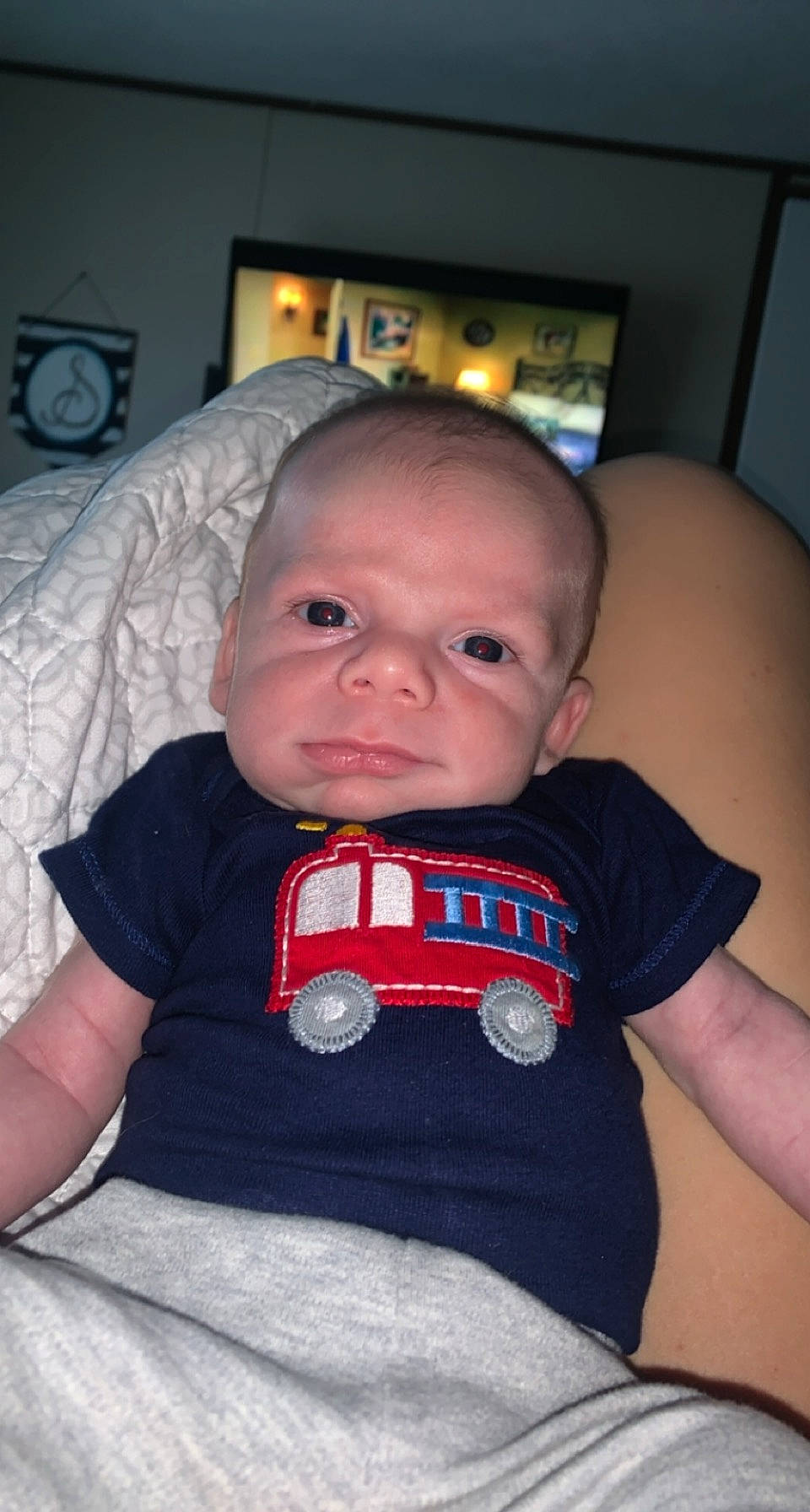 Wesley is registered to the contest to win money with this photo: baby, baby_products, baby_toddler_clothing, cheek, child, cool, display_device, electronics, flat_panel_display, home_accessories, iris, living_room, nose, organ, person, picture_frame, product, screen, skin, toddler