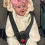 Zenayda joined the competition — help win amazing prizes! baby, child, car_seat, pink_bow, snowsuit, winter_clothing, smile, blue_eyes, face, seatbelt, infant, cute, warm, indoor, happy, headwear, padded_clothing, jacket, transport, safety