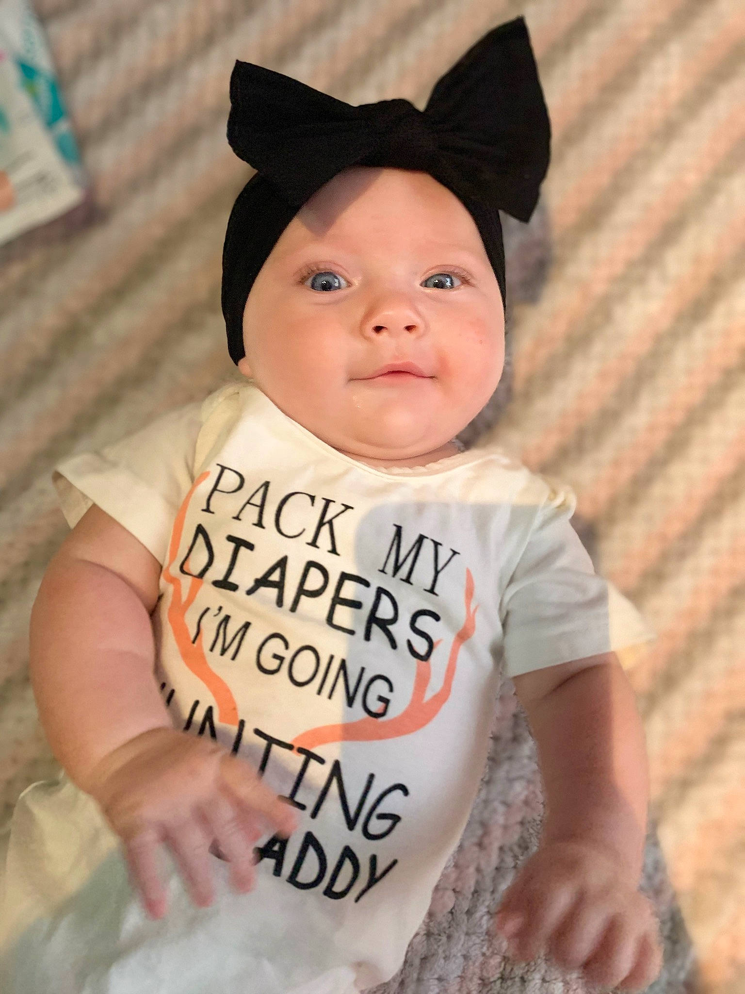 Oaklynn joined the competition — help win amazing prizes! baby, baby_toddler_clothing, cap, cheek, child, costume_hat, face, fashion_accessory, font, fun, happy, head, headwear, neck, pattern, person, portrait_photography, sleeve, smile, t_shirt