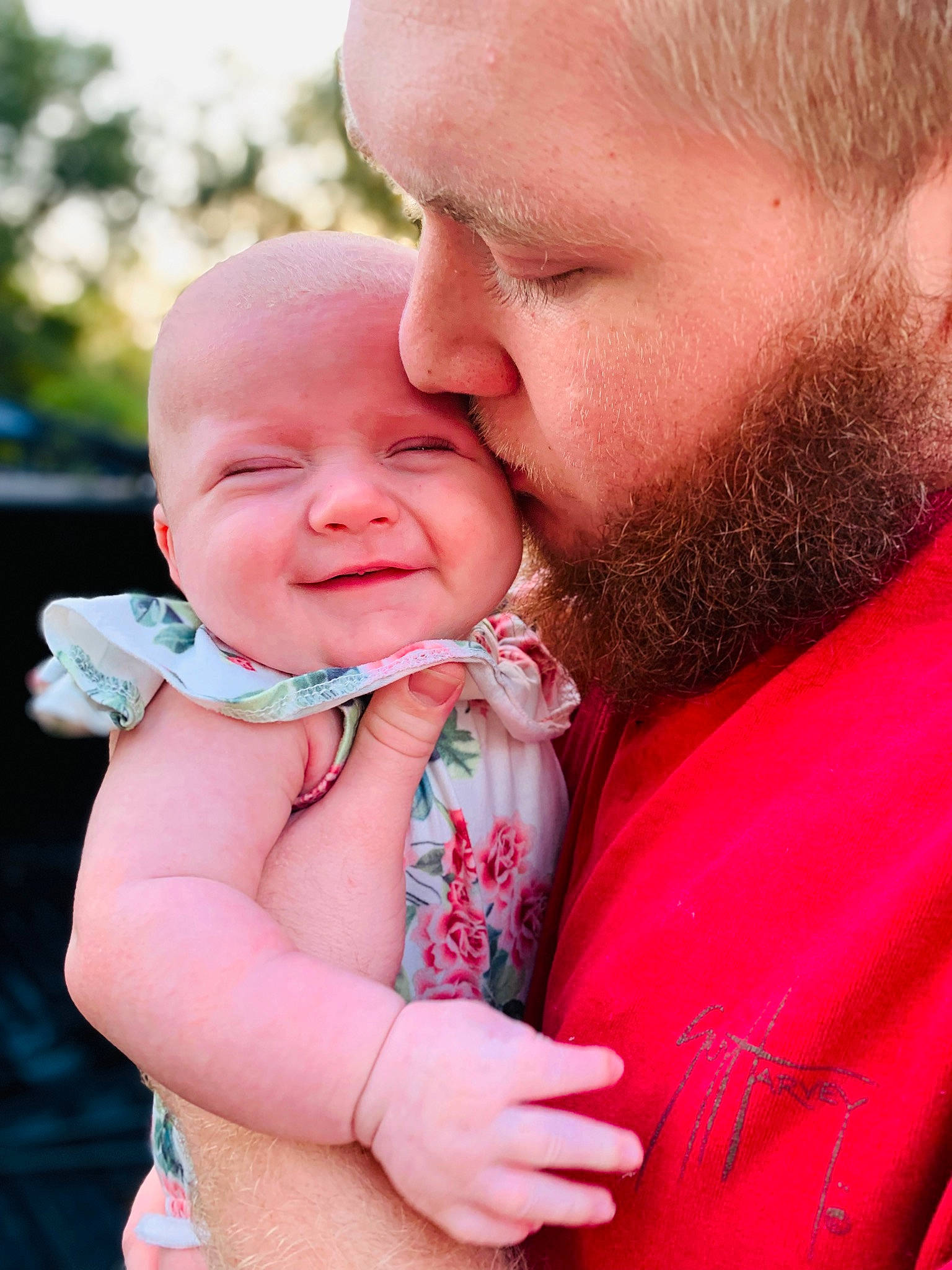 Oaklynn is registered to the contest to win money with this photo: baby, baby_toddler_clothing, beard, cheek, child, event, face, fun, gesture, grass, happy, lip, mouth, nose, people_in_nature, person, pink, skin, smile, thumb