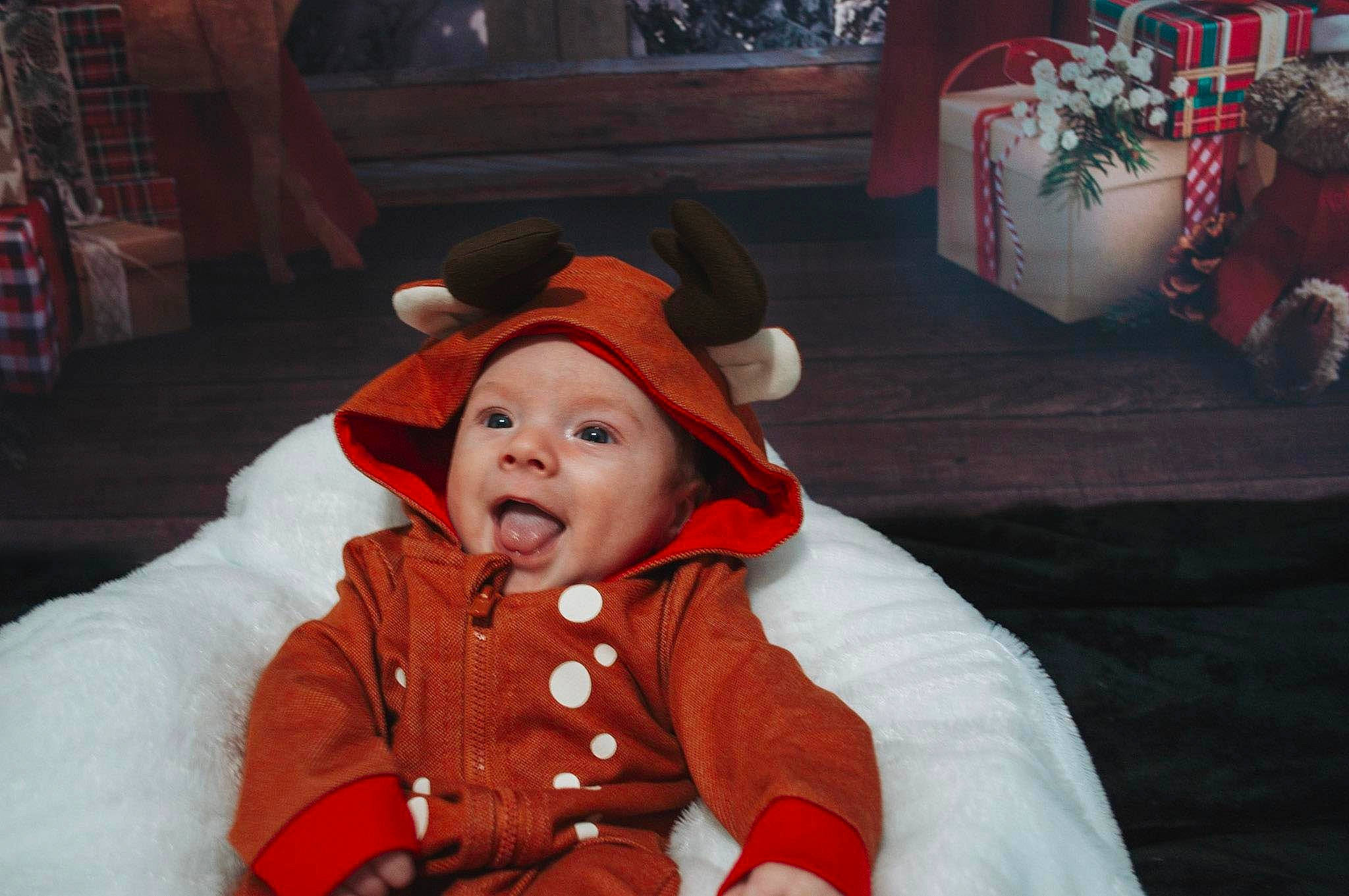 Trevon joined the competition — help win amazing prizes! baby, carmine, christmas, christmas_eve, costume_hat, event, fictional_character, fun, fur, fur_clothing, happy, hat, headwear, holiday, person, red, sleeve, smile, sun_hat, toddler