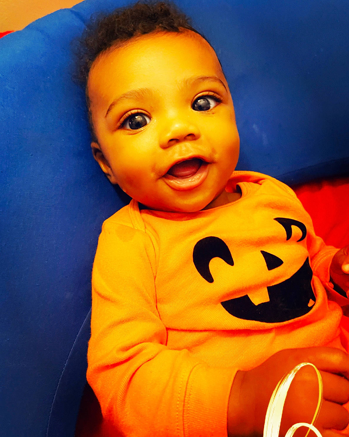 Jakai joined the competition — help win amazing prizes! baby, blue, calabaza, cheek, child, electric_blue, finger, fun, happy, mouth, nose, orange, person, portrait_photography, sitting, smile, thumb, toddler, toy, vegetable