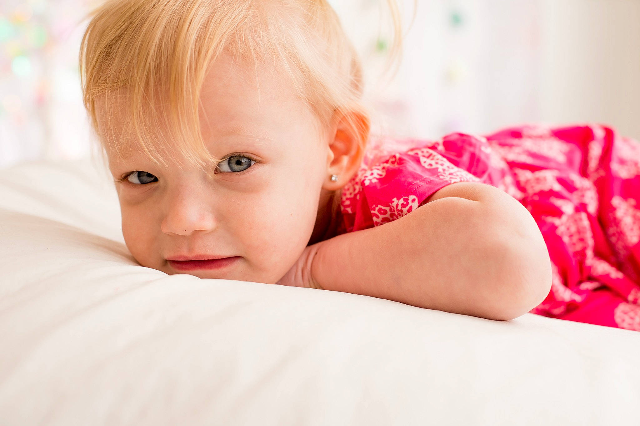 Mila is registered to the contest to win money with this photo: baby, baby_toddler_clothing, brown_hair, cheek, child, comfort, eyelash, face, flash_photography, happy, human_leg, iris, linens, lip, person, sitting, skin, sleeve, smile, toddler