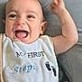 arm, baby, bib, child, clothing, cute, expression, face, footprints, happy, human, infant, laughing, lying_down, mouth_open, portrait, skin, smile, soft_surface, young