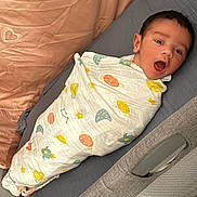 Kiansh joined the competition — help win amazing prizes! awake, baby, bed, blanket, child, comfort, cozy, cute, expression, face, indoor, infant, lying_down, pillow, portrait, sleepwear, soft, space_theme, swaddle, young_child