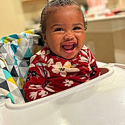 Zalaya joined the competition — help win amazing prizes! toddler, child, smiling, high_chair, red_clothing, floral_pattern, indoor, kitchen, happy, person, face, baby, seat, cute, cheerful, young_child, home, laughter, colorful, portrait
