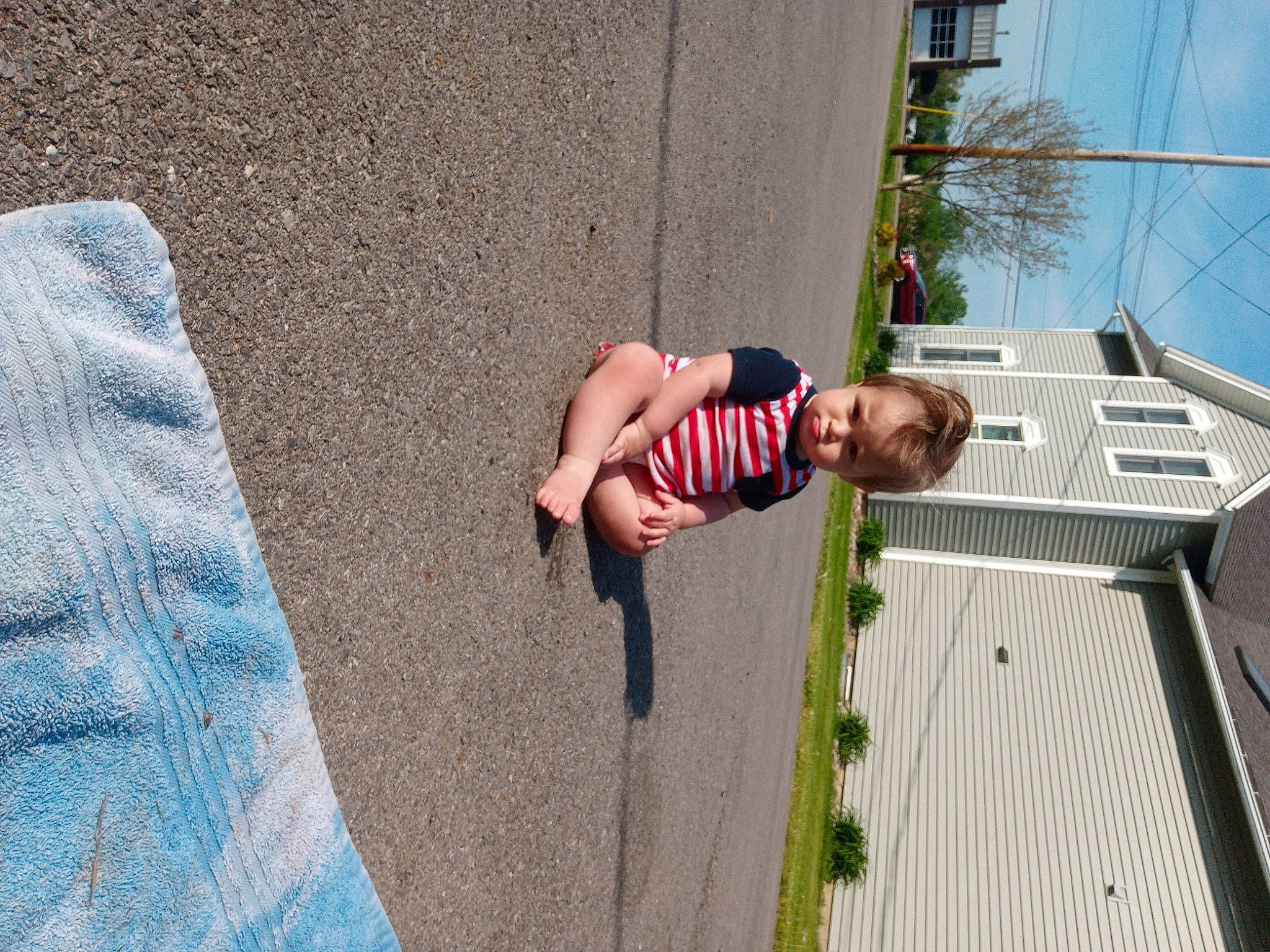 Eli joined the competition — help win amazing prizes! asphalt, concrete, facade, fun, human_leg, leisure, pedestrian, person, plant, recreation, road, road_surface, shadow, sidewalk, sky, smile, street_fashion, t_shirt, toddler, tree