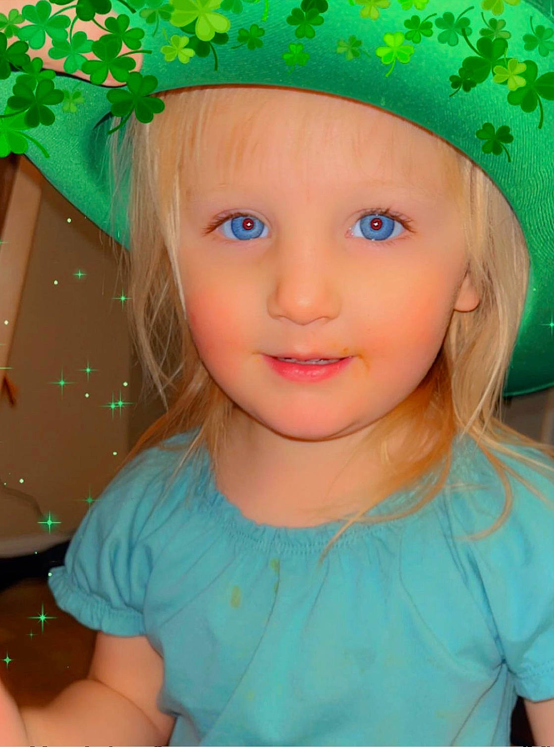Kilah is registered to the contest to win money with this photo: aqua, blond, blue, cap, child, costume_hat, eyebrow, face, facial_expression, fun, grass, green, hairstyle, happy, hat, head, headgear, headwear, joy, party_supply