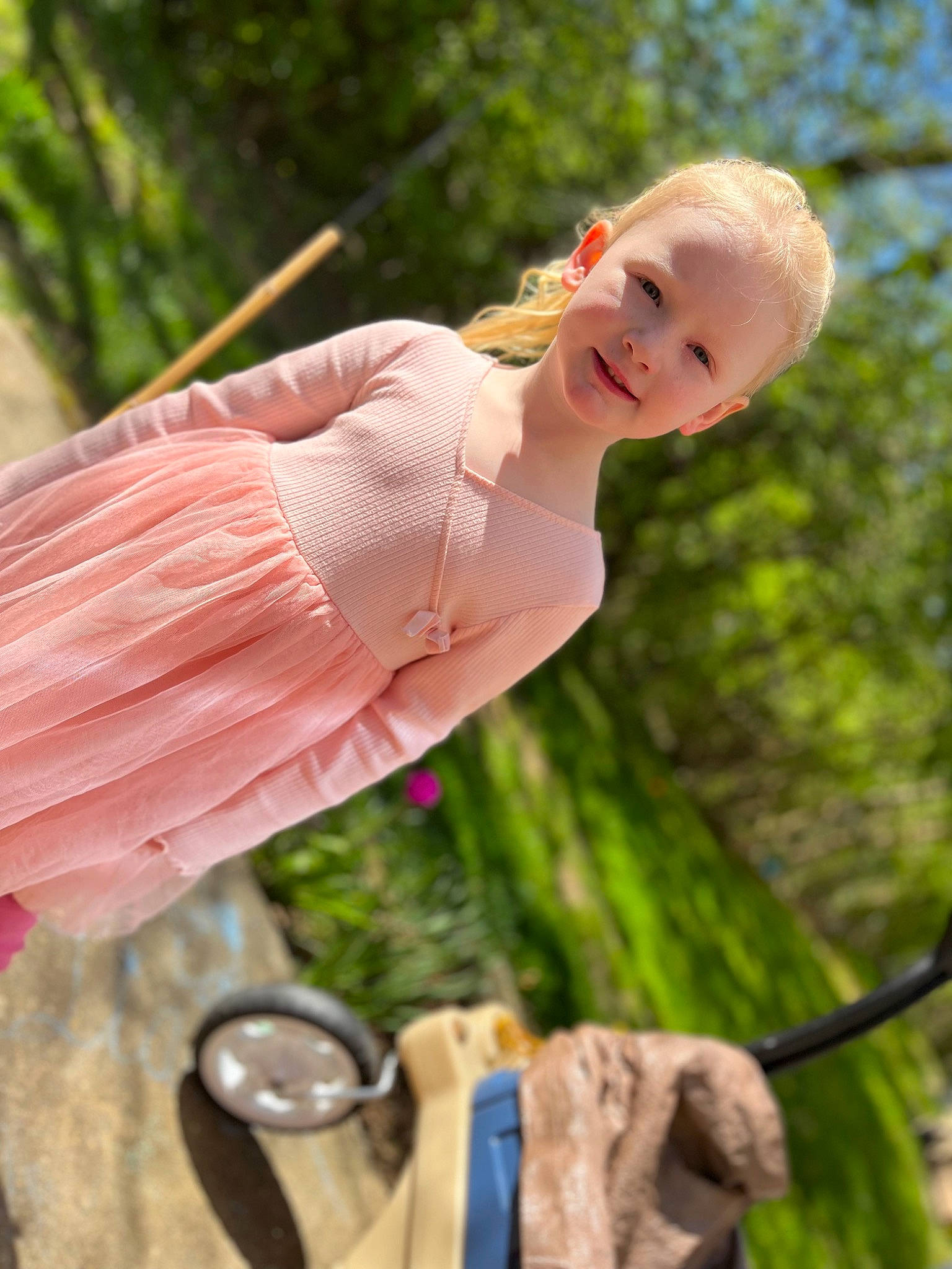 Raya is registered to the contest to win money with this photo: child, face, fawn, fun, grass, hand, happy, leaf, leisure, people_in_nature, person, pink, plant, recreation, skin, sky, smile, sunglasses, toddler, tree