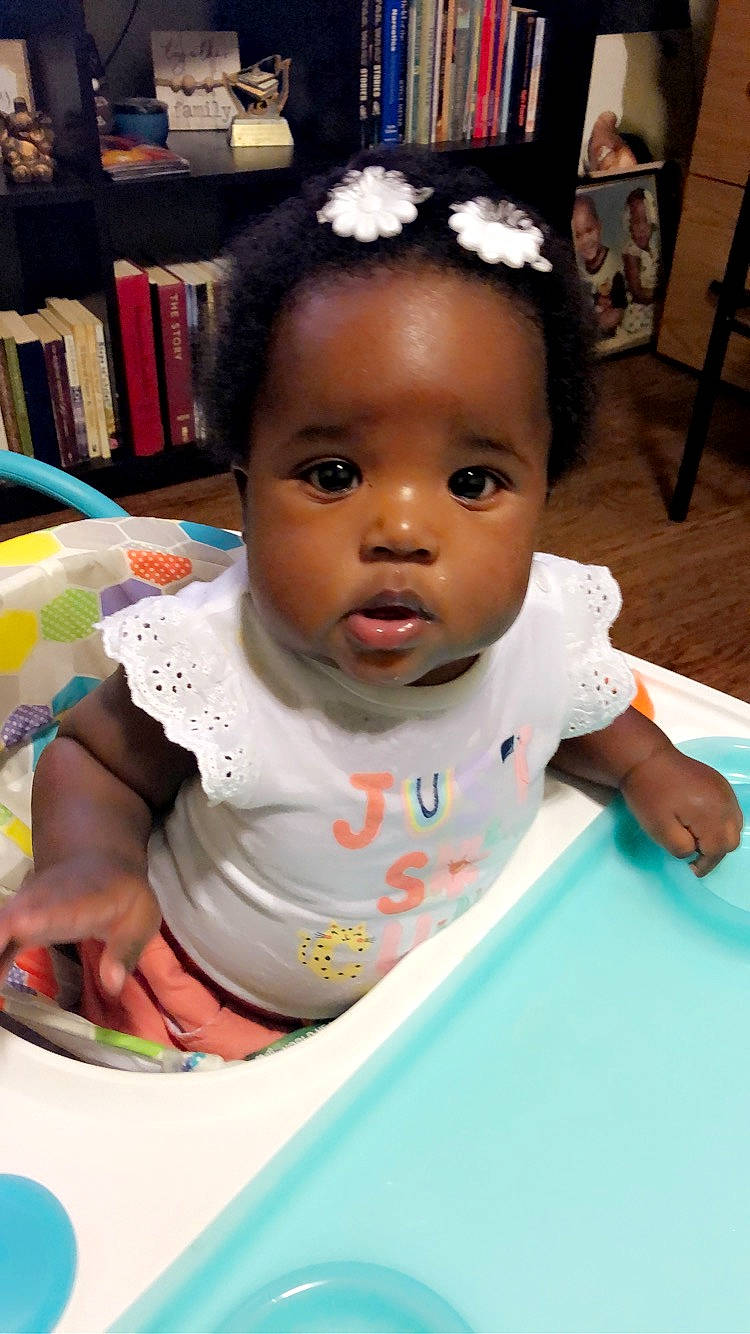 Journee is registered to the contest to win money with this photo: baby, baby_toddler_clothing, chair, cheek, child, chin, eyebrow, eyelash, facial_expression, fun, hairstyle, happy, human, iris, nose, person, product, room, skin, t_shirt