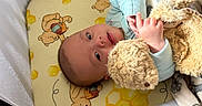 Jasper joined the competition — help win amazing prizes! baby, infant, teddy_bear, blanket, mattress, crib, sleepwear, child, cute, soft_toy, bedtime, resting, indoor, person, face, hand, lying_down, comfort, nursery, cozy