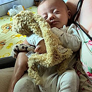 Jasper joined the competition — help win amazing prizes! baby, sleeping, stuffed_animal, cuddling, arms, person, bedding, blanket, pattern, bear, honeycomb, soft_toy, infant, clothing, cute, peaceful, resting, indoors, comfort, nap