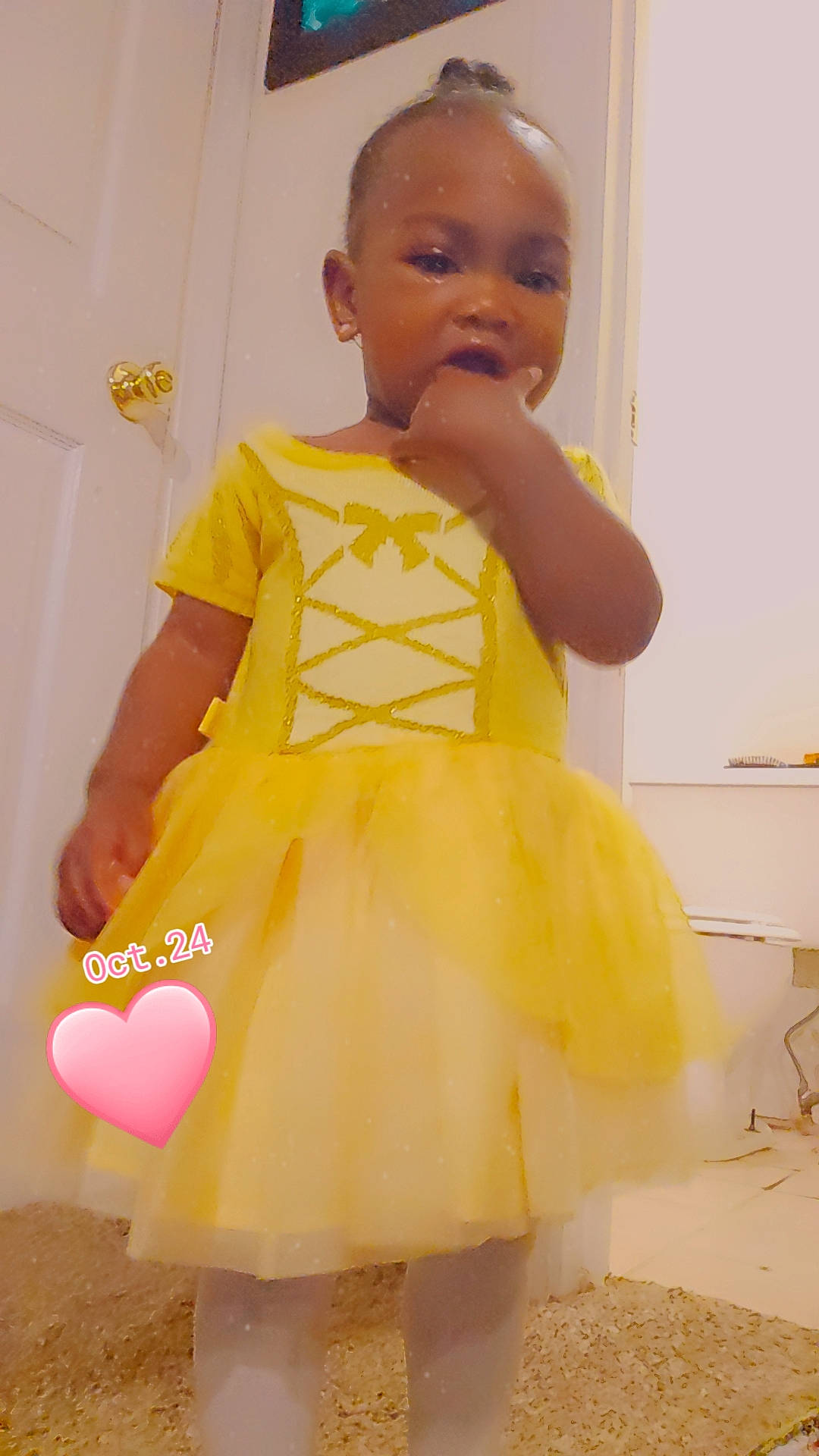 Naomi is registered to the contest to win money with this photo: baby, baby_toddler_clothing, child, day_dress, dress, event, fashion_design, formal_wear, fun, hairstyle, happy, one_piece_garment, pattern, peach, person, ruffle, sitting, sleeve, toddler, white