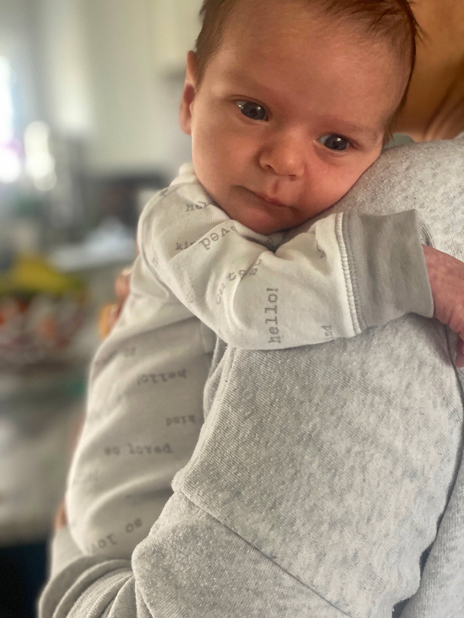 William is registered to the contest to win money with this photo: baby, baby_toddler_clothing, cheek, chin, collar, comfort, eyebrow, eyelash, face, finger, happy, iris, lip, neck, nose, outerwear, person, skin, sleeve, standing