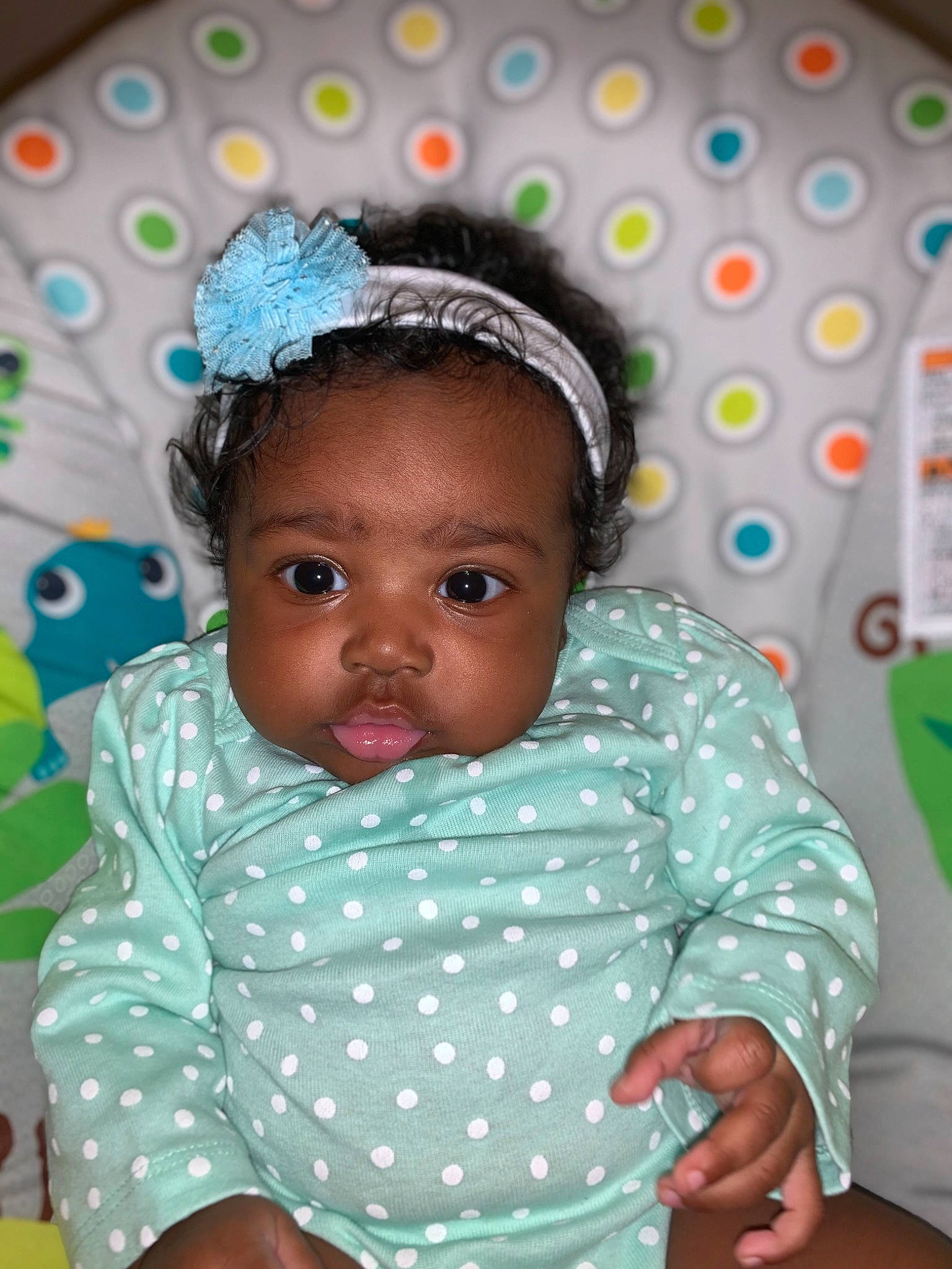 Aziyah is registered to the contest to win money with this photo: baby, baby_toddler_clothing, child, hair_accessory, iris, pattern, person, polka_dot, toddler