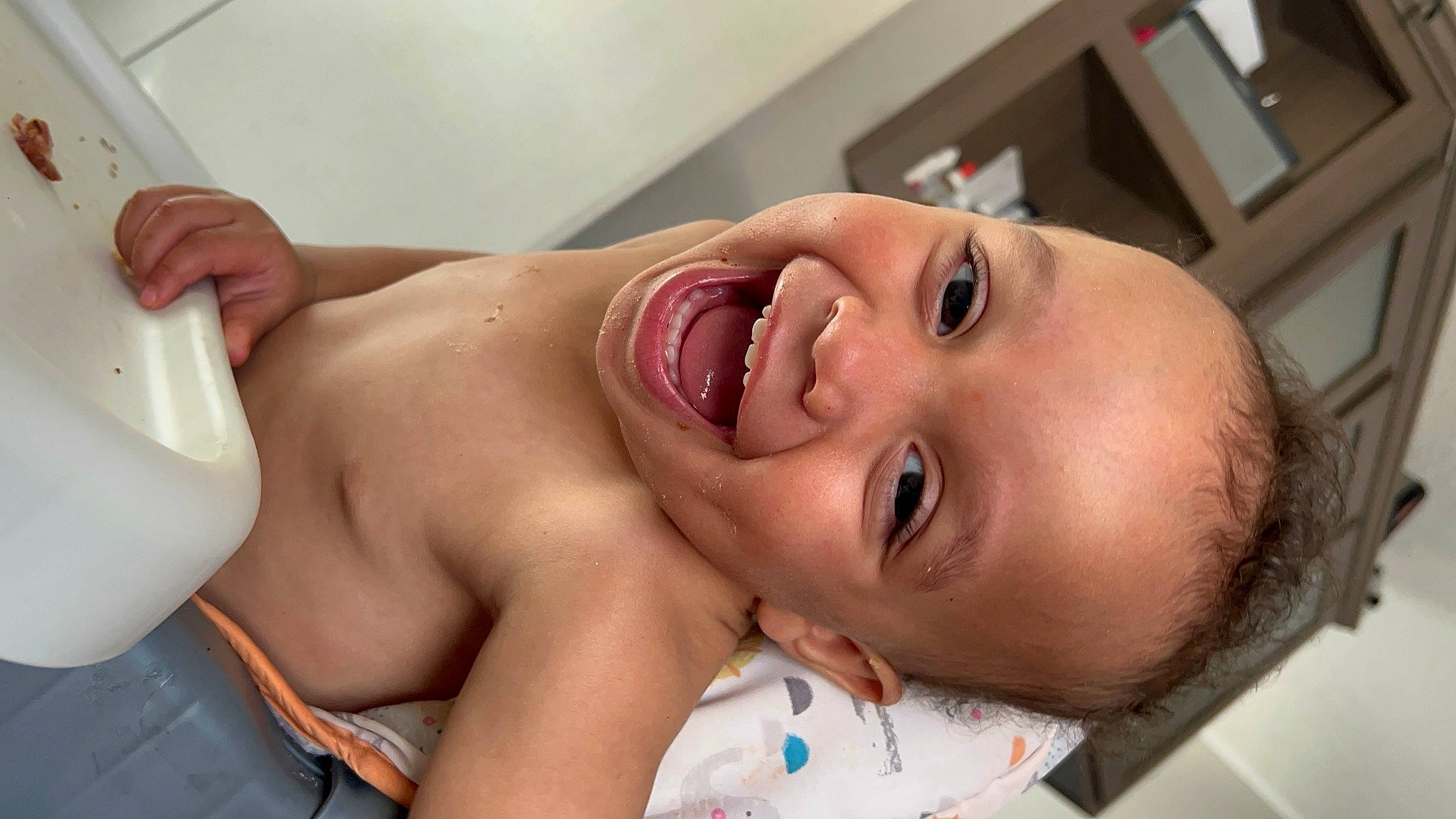 Asiah is registered to the contest to win money with this photo: abdomen, baby, bathing, black_hair, chest, comfort, ear, eyebrow, eyelash, hair, happy, lip, mouth, neck, nose, person, skin, smile, stomach, toddler