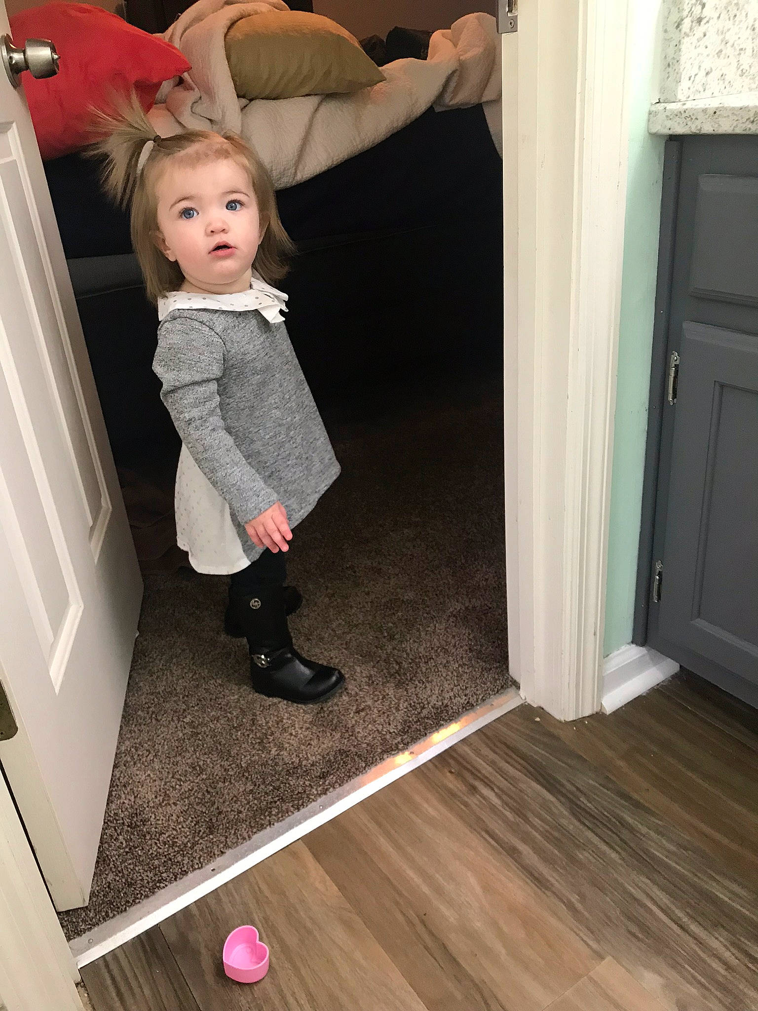 Natalie Crewe is registered to the contest to win money with this photo: blond, child, floor, flooring, footwear, fun, hardwood, laminate_flooring, leg, person, pink, play, room, shoe, standing, surprise, toddler, wood, wood_flooring