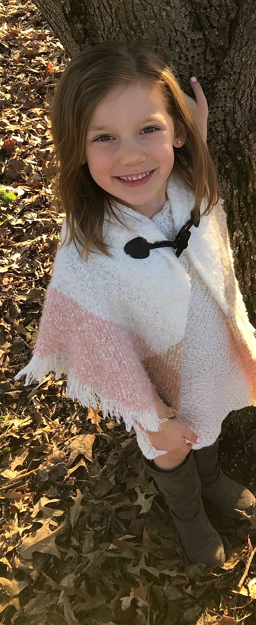 Adelaide is registered to the contest to win money with this photo: brown_hair, child, child_model, clothing, costume, fashion_accessory, fur, joy, lip, long_hair, outerwear, pattern, person, pink, scarf, smile, textile, toddler, wool