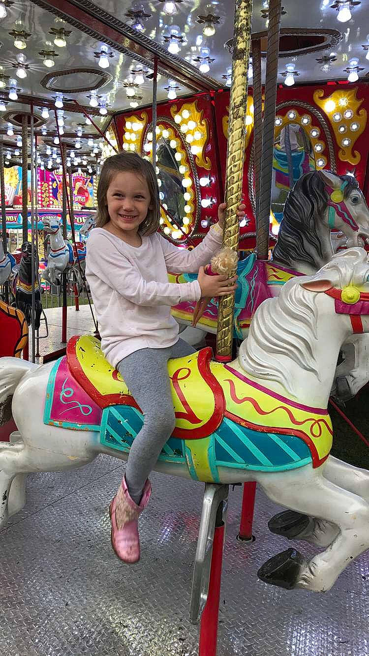 Adelaide is registered to the contest to win money with this photo: amusement_park, amusement_ride, carousel, fun, joy, nonbuilding_structure, park, person, recreation