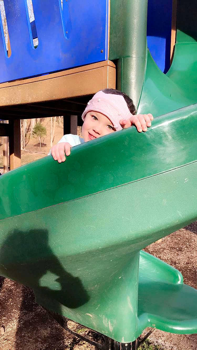 Mckenna joined the competition — help win amazing prizes! green, headwear, leisure, outdoor_play_equipment, person, playground, playground_slide, public_space, recreation