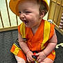 Navaya joined the competition — help win amazing prizes! toddler, child, smiling, hard_hat, construction_vest, toy_car, socks, indoor, play_area, floor_mat, wooden_bars, happy, cute, playful, baby, earrings, seat, daycare, colorful, laughing