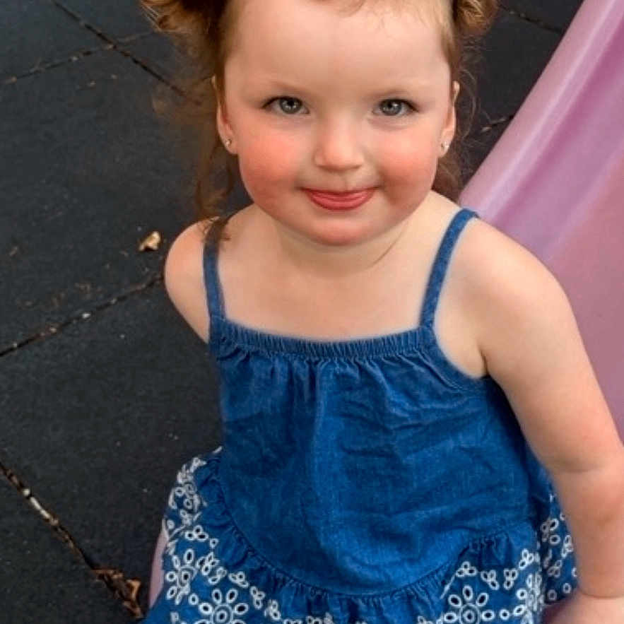 Navaya joined the competition — help win amazing prizes! child, girl, pigtails, blue_dress, slide, playground, smile, sandals, outdoor, brick_wall, rubber_mat, sitting, cute, happy, person, childhood, summer, fun, play, portrait