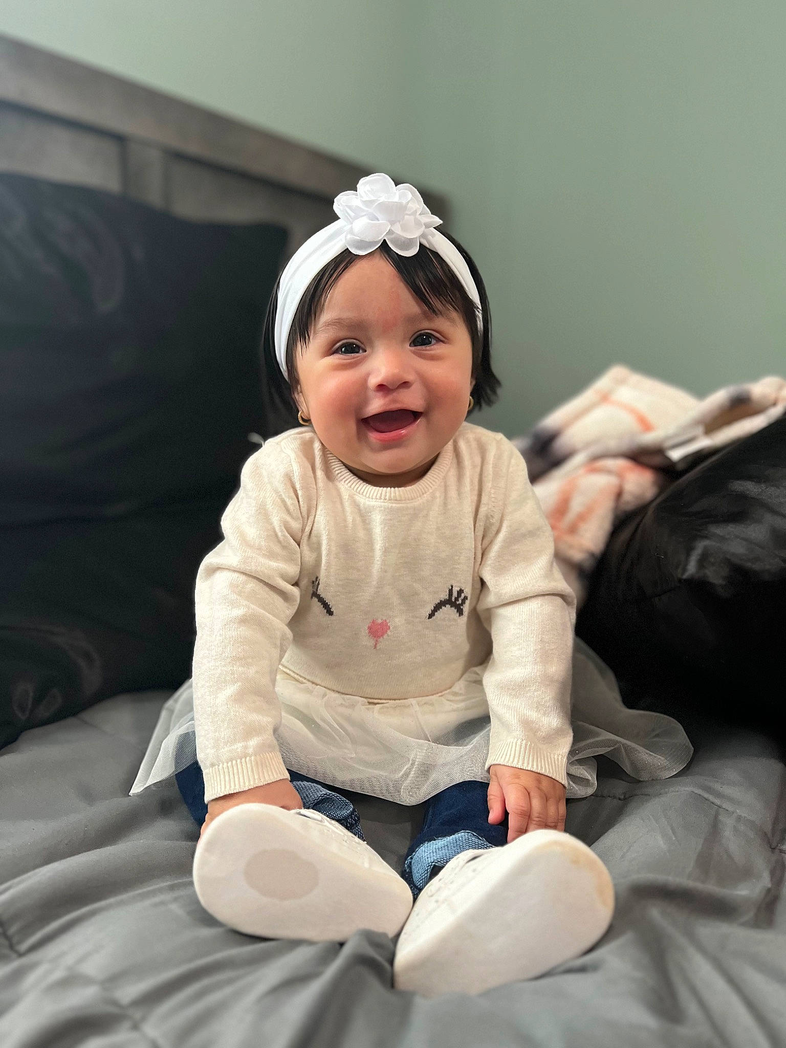 Leah joined the competition — help win amazing prizes! baby, baby_toddler_clothing, cap, car_seat, child, comfort, eye, fashion_accessory, flash_photography, fun, happy, headband, headgear, headwear, human_leg, joy, knee, laugh, person, sitting