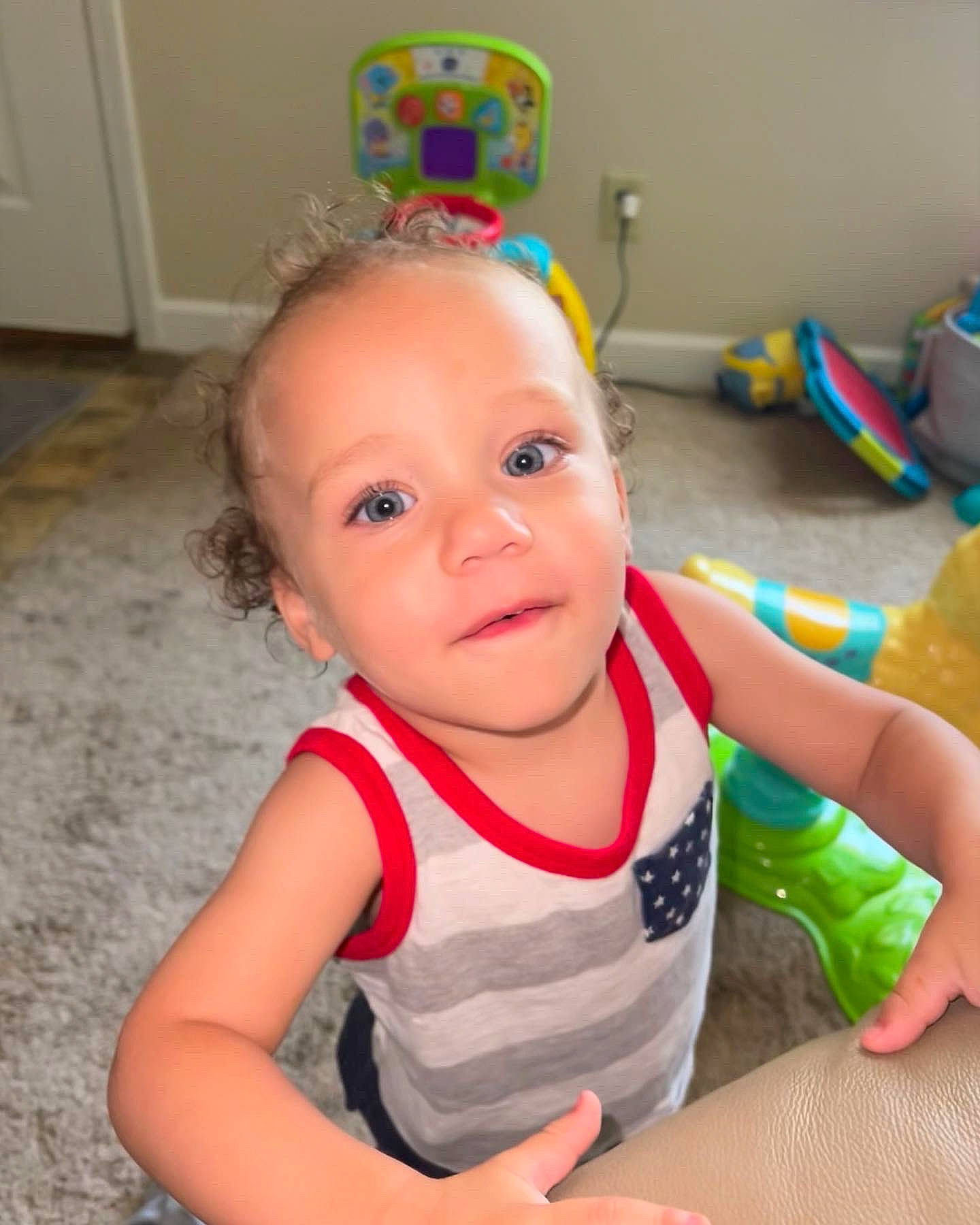 Draven is registered to the contest to win money with this photo: baby, baby_playing_with_toys, baby_products, baby_toddler_clothing, cheek, child, finger, flooring, fun, happy, iris, party_supply, person, play, room, sitting, skin, sleeve, smile, thumb