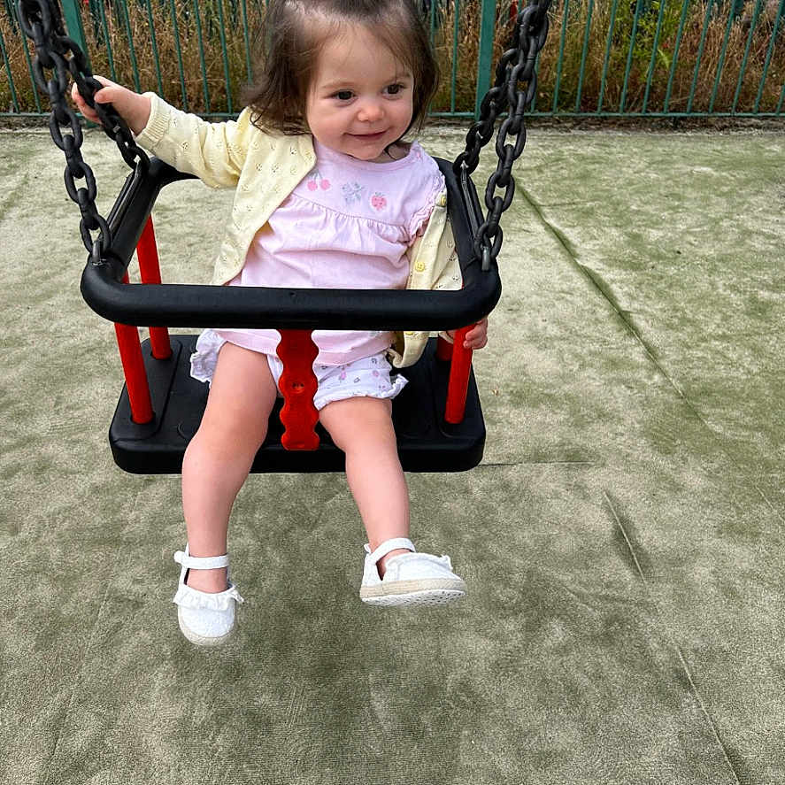 Freyja joined the competition — help win amazing prizes! toddler, child, swing, playground, smile, yellow_hair_bow, white_shoes, pink_dress, jacket, chains, fence, grass, outdoor, fun, happy, person, play, recreation, daytime, park