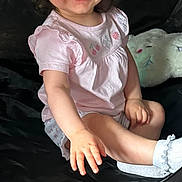 Freyja joined the competition — help win amazing prizes! toddler, child, smiling, pink_shirt, pigtails, indoor, plush_toy, carpet, black_background, happy, cute, sitting, reaching_hand, baby, person, portrait, casual, cozy, playful, young_child