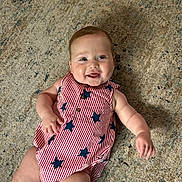 Remington joined the competition — help win amazing prizes! baby, infant, smiling, lying_down, carpet, red_striped_clothing, blue_stars, cute, happy, child, portrait, indoors, skin, face, arm, legs, buttoned_outfit, one_person, casual, young_child