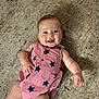 baby, infant, smiling, lying_down, carpet, red_striped_clothing, blue_stars, cute, happy, child, portrait, indoors, skin, face, arm, legs, buttoned_outfit, one_person, casual, young_child