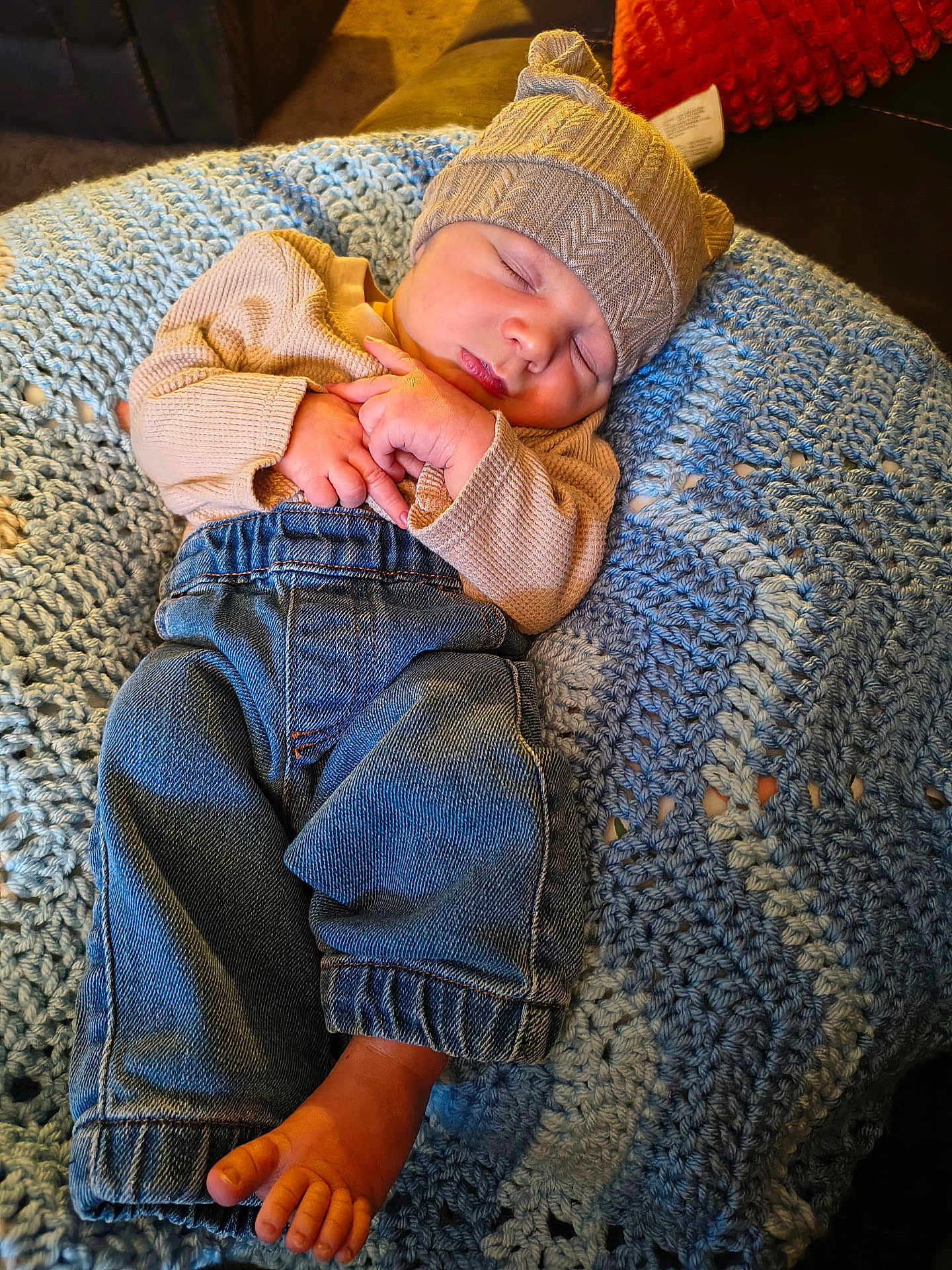 Atlas joined the competition — help win amazing prizes! baby, sleeping, hat, sweater, jeans, crocheted_blanket, cozy, indoor, soft_texture, peaceful, child, foot, hand, nap, warm_clothing, couch, home, portrait, infant, relaxation