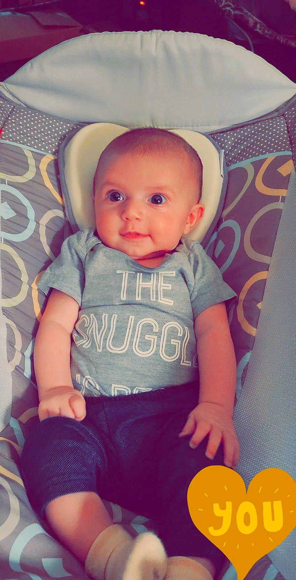 Nola is registered to the contest to win money with this photo: baby, baby_products, baby_toddler_clothing, cheek, child, pattern, person, product, sitting, skin, toddler