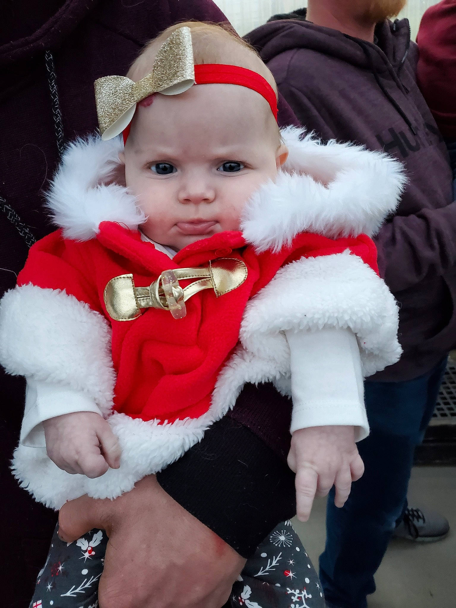 Emma Rose is registered to the contest to win money with this photo: baby, child, christmas, christmas_eve, fictional_character, fur, fur_clothing, holiday, lap, person, santa_claus, toddler