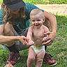 Marlin joined the competition — help win amazing prizes! baby, diaper, child, adult, beard, cap, grass, outdoor, sidewalk, smile, walking, support, crouching, person, happy, feet, casual_clothing, nature, playful, family