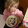Isabella joined the competition — help win amazing prizes! child, girl, blue_eyes, pink_sweater, hearts_pattern, ice_cream, dessert, cup, indoor, wooden_wall, toy, mirror, smile, messy_hair, holding, sweet, food, happy, playful, cheeky