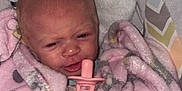 Kali joined the competition — help win amazing prizes! baby, blanket, pacifier, infant, pink, cozy, cute, wrapped, clothing, sleeping_area, face, newborn, soft, pattern, person, indoors, resting, expression, head, closeup