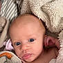 Kali is registered to the contest to win money with this photo: baby, infant, blanket, pacifier, blue_eyes, face, skin, expression, soft_texture, bed, striped_sheet, hand, closeup, young_child, cuteness, wrapped, cozy, indoors, portrait, sleepwear